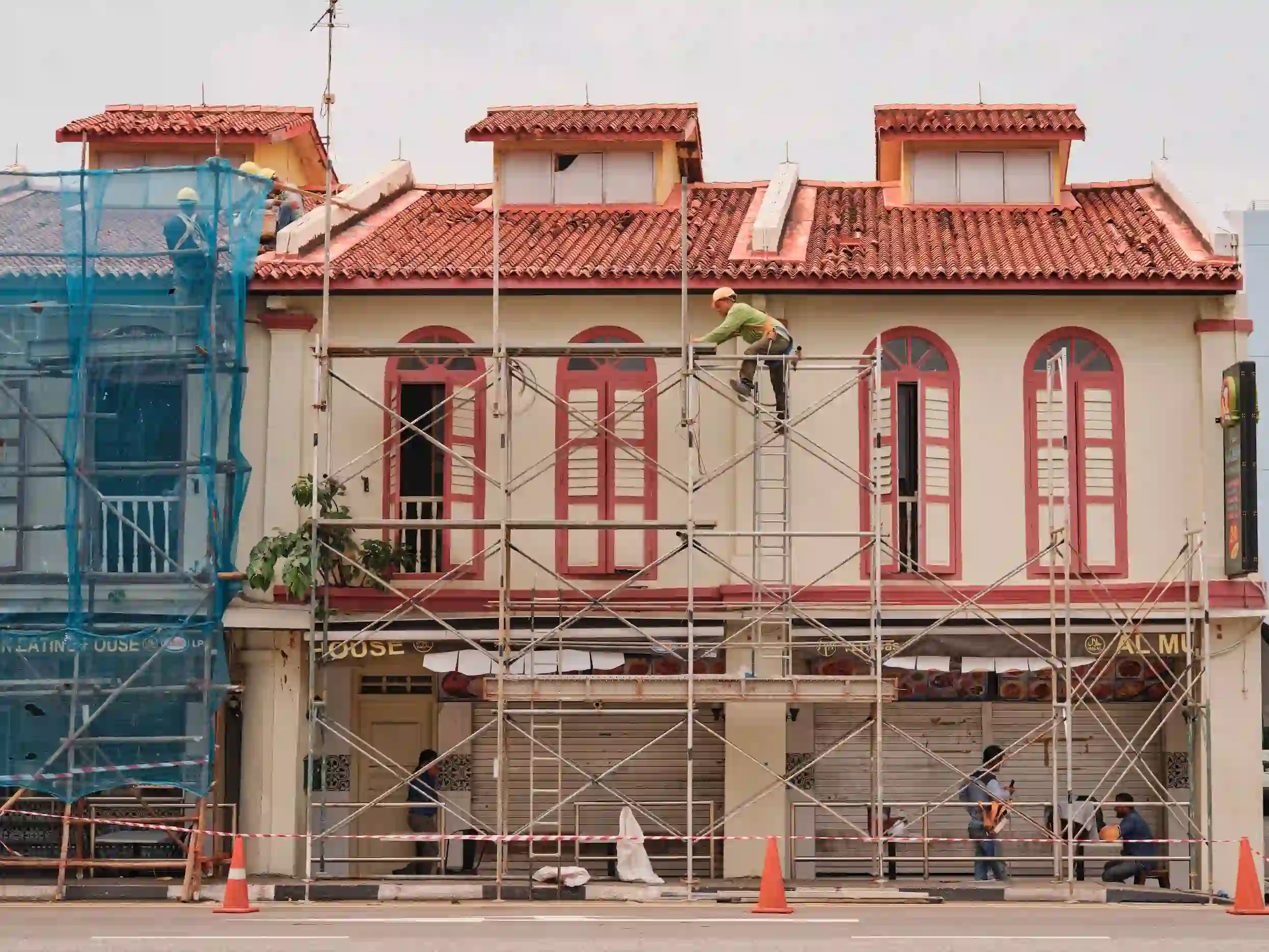 San Jose Premier Scaffolding Rental — scaffolding along a decorative facade with red window trim.
